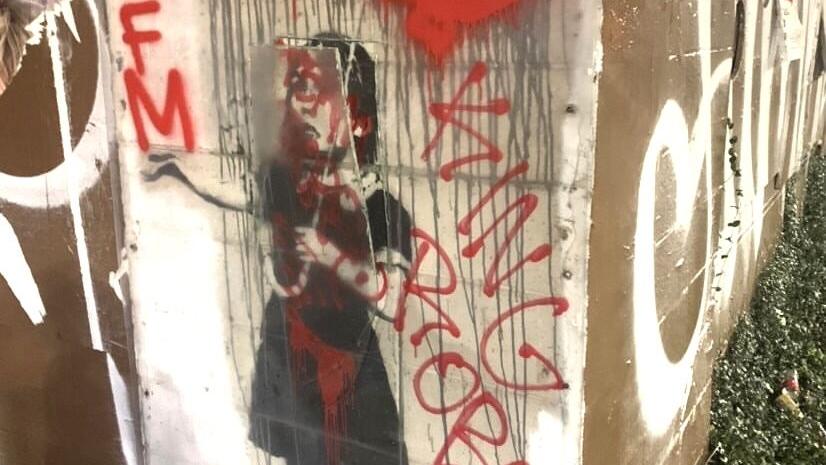 Second Banksy vandalized: 2008 'Umbrella Girl' painting by the graffiti master attacked
